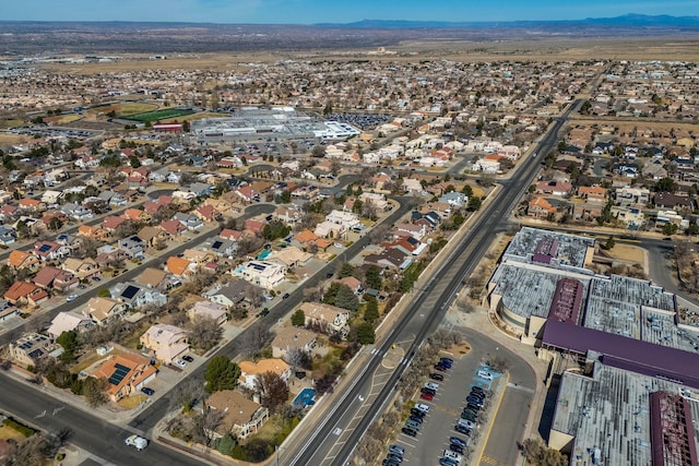 drone / aerial view featuring a mountain view and a residential view