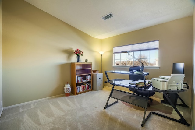 office featuring carpet, visible vents, and baseboards