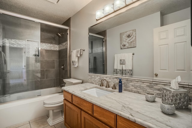 full bath featuring shower / bath combination with glass door, backsplash, toilet, vanity, and tile patterned floors