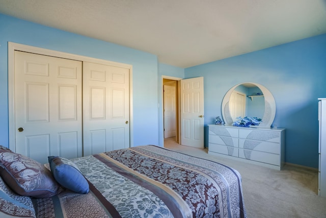 bedroom with carpet floors and a closet