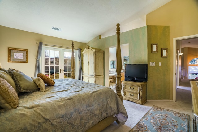 bedroom with visible vents, light colored carpet, lofted ceiling, access to outside, and french doors