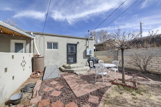 view of patio featuring fence