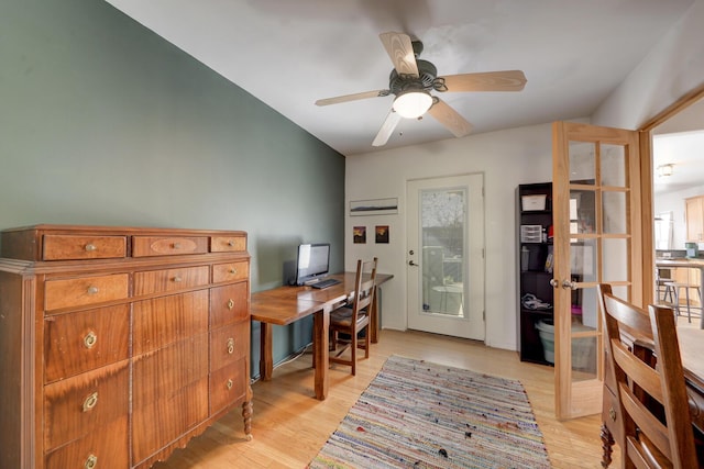 home office featuring ceiling fan, french doors, and light wood-style flooring