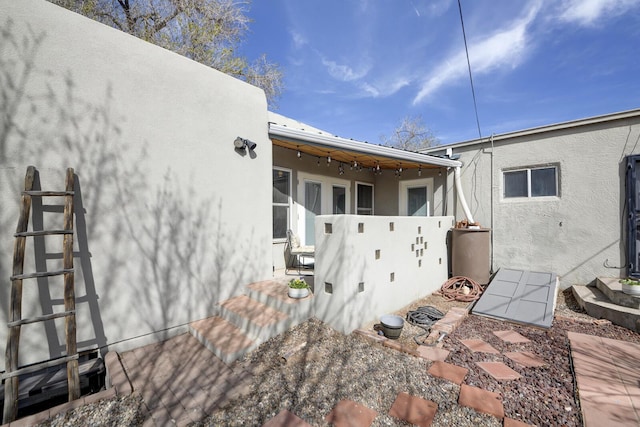 view of side of property featuring stucco siding