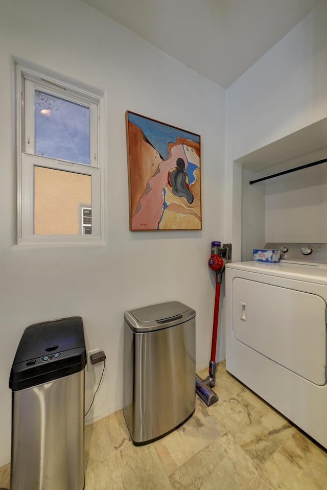 washroom featuring laundry area and washer and dryer