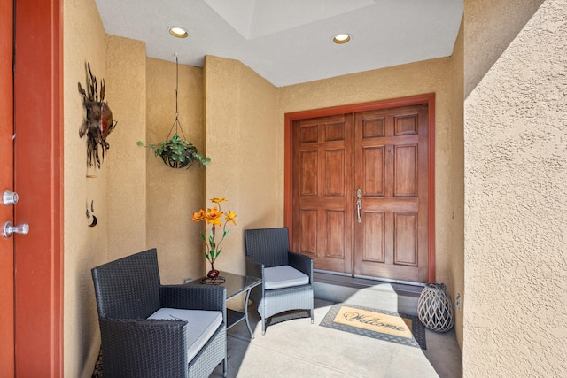 property entrance featuring stucco siding