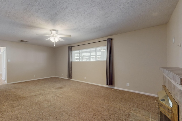 empty room featuring baseboards, visible vents, a ceiling fan, and carpet