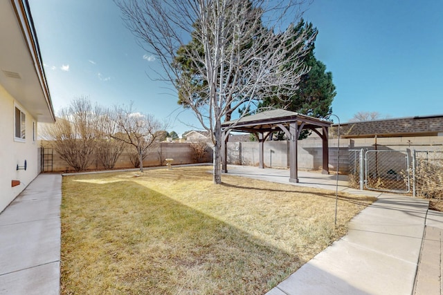 view of yard with a gazebo and a fenced backyard