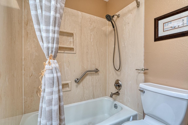 full bathroom featuring shower / bath combo with shower curtain and toilet