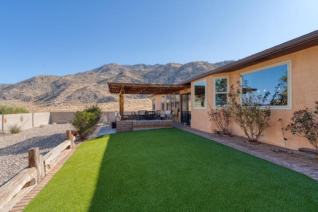 view of yard with a mountain view, a patio, and a fenced backyard