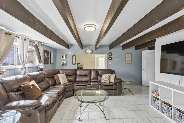 living area featuring beam ceiling