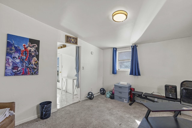 workout room with carpet flooring and vaulted ceiling