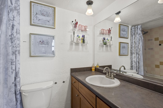 bathroom featuring toilet, a textured ceiling, a shower with shower curtain, vanity, and a textured wall