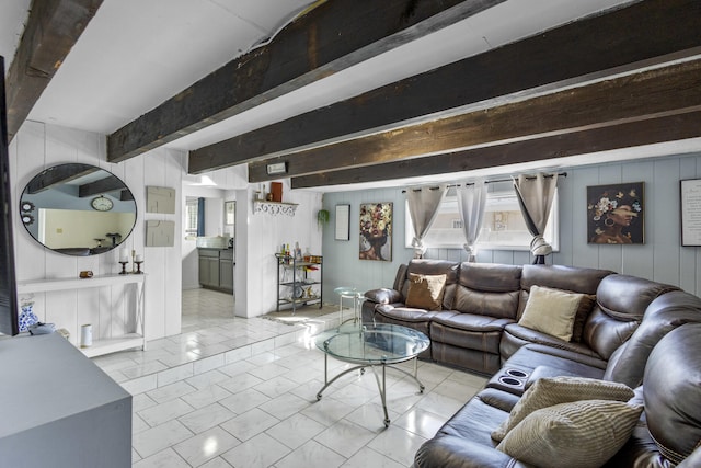 living room featuring beamed ceiling