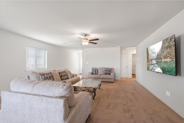 living room with light carpet and a ceiling fan