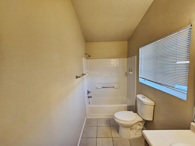 bathroom featuring tile patterned floors, toilet, shower / washtub combination, baseboards, and vanity