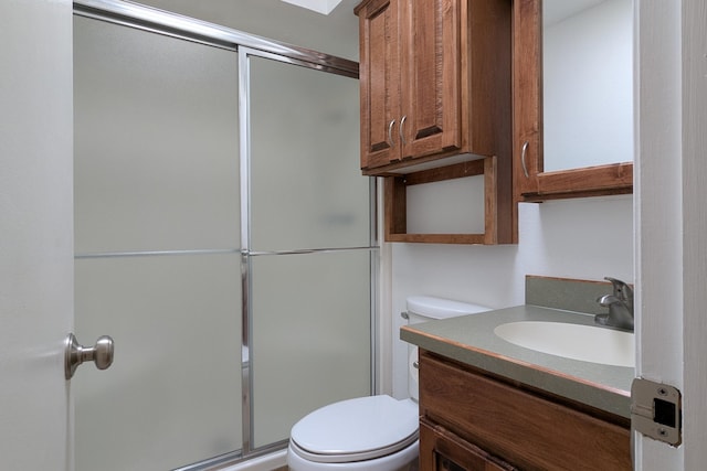 full bathroom with an enclosed shower, toilet, and vanity