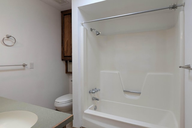 bathroom featuring bathtub / shower combination, toilet, and vanity