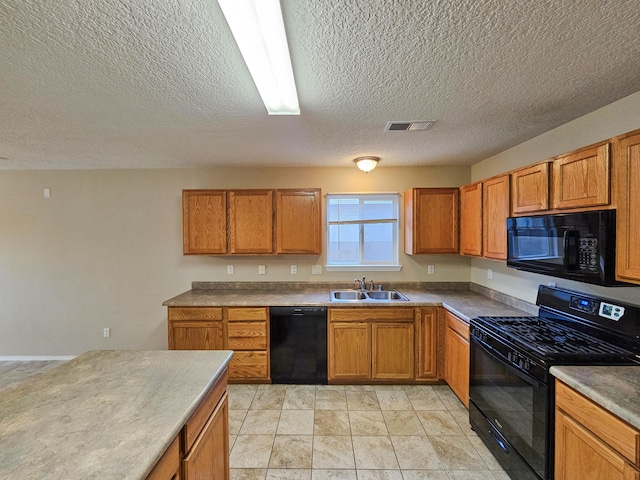 6619 Country Hills Ct NW, Albuquerque, NM 87114 - kitchen featuring brown cabinetry, visible vents, black appliances, and a sink