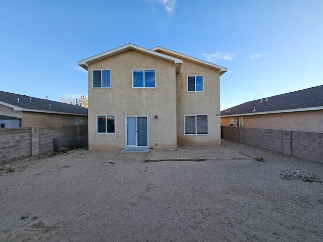 6619 Country Hills Ct NW, Albuquerque, NM 87114 - rear view of property with stucco siding and a fenced backyard