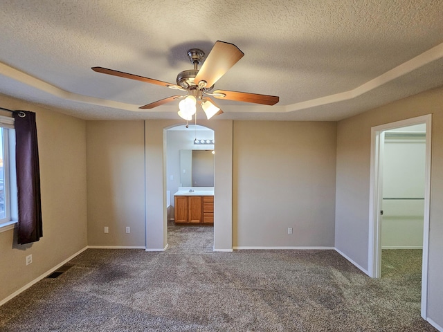 6619 Country Hills Ct NW, Albuquerque, NM 87114 - carpeted empty room featuring visible vents, a ceiling fan, baseboards, and a textured ceiling