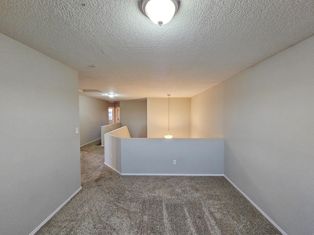 6619 Country Hills Ct NW, Albuquerque, NM 87114 - carpeted spare room featuring a textured ceiling and baseboards