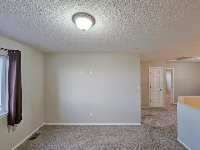 6619 Country Hills Ct NW, Albuquerque, NM 87114 - carpeted spare room with a wealth of natural light, visible vents, and baseboards