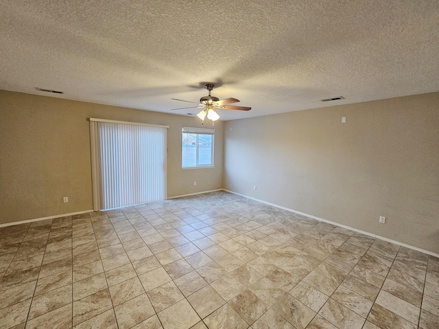 6619 Country Hills Ct NW, Albuquerque, NM 87114 - spare room featuring a ceiling fan, visible vents, and baseboards