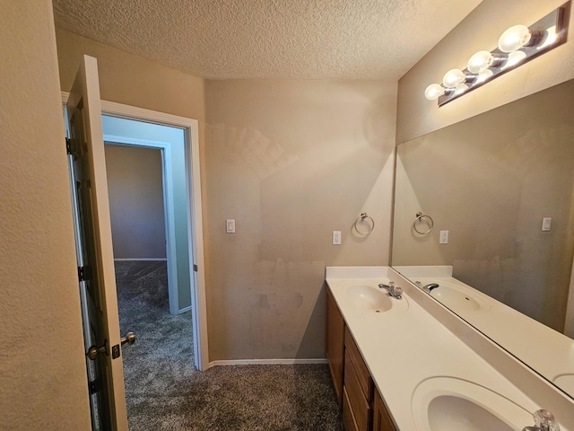 6619 Country Hills Ct NW, Albuquerque, NM 87114 - bathroom with double vanity, a textured ceiling, baseboards, and a sink