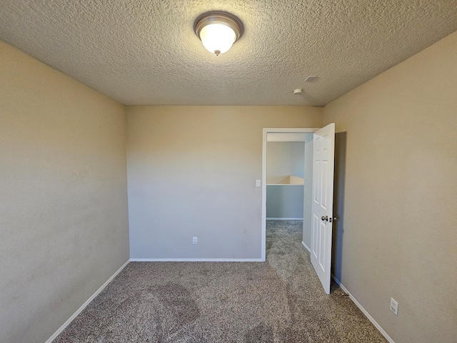 6619 Country Hills Ct NW, Albuquerque, NM 87114 - unfurnished room featuring baseboards, carpet, and a textured ceiling