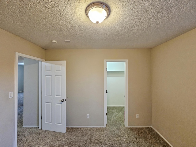 6619 Country Hills Ct NW, Albuquerque, NM 87114 - unfurnished bedroom with a closet, baseboards, carpet, and a spacious closet
