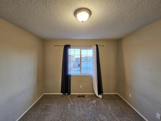 6619 Country Hills Ct NW, Albuquerque, NM 87114 - empty room featuring visible vents, a textured ceiling, baseboards, and carpet floors