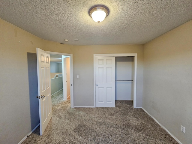 6619 Country Hills Ct NW, Albuquerque, NM 87114 - unfurnished bedroom with a closet, carpet flooring, a textured ceiling, and baseboards