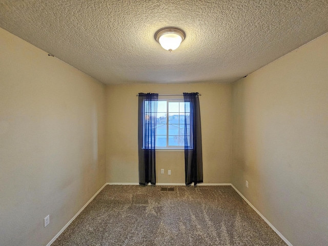 6619 Country Hills Ct NW, Albuquerque, NM 87114 - carpeted empty room with baseboards, visible vents, and a textured ceiling