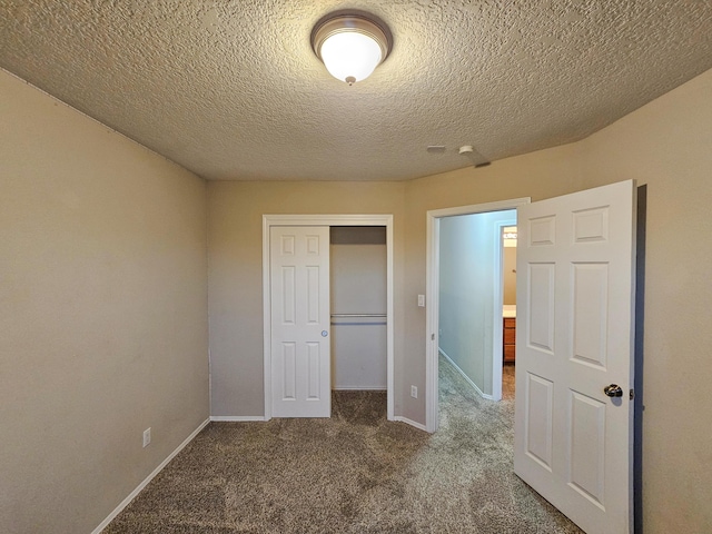 6619 Country Hills Ct NW, Albuquerque, NM 87114 - unfurnished bedroom featuring a closet, baseboards, carpet, and a textured ceiling