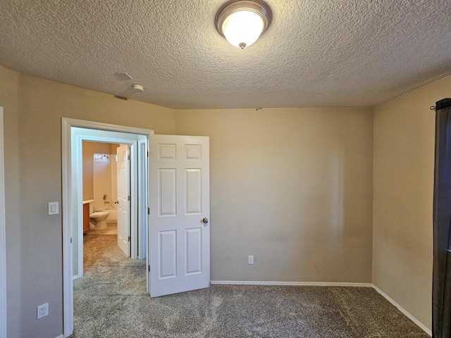 6619 Country Hills Ct NW, Albuquerque, NM 87114 - unfurnished bedroom featuring a textured ceiling, baseboards, and carpet floors