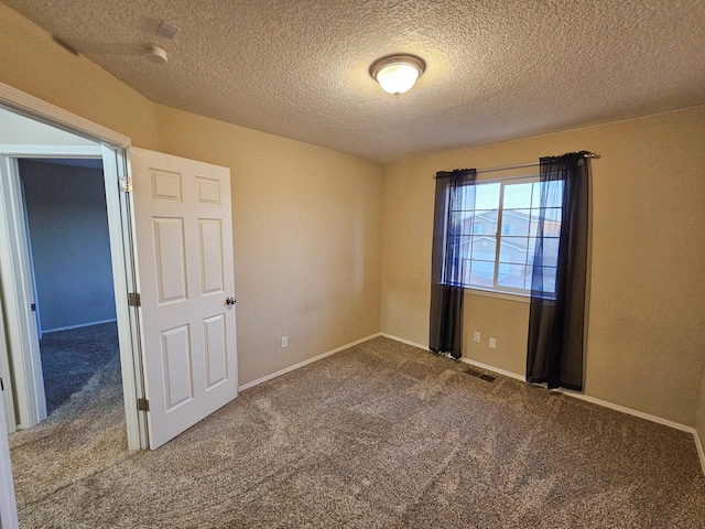 6619 Country Hills Ct NW, Albuquerque, NM 87114 - carpeted empty room featuring visible vents, baseboards, and a textured ceiling