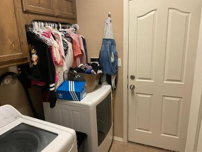 washroom featuring light tile patterned floors, cabinet space, and independent washer and dryer