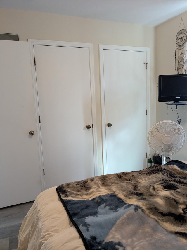 bedroom featuring wood finished floors