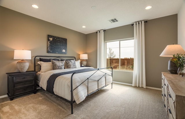 bedroom featuring recessed lighting, baseboards, visible vents, and light colored carpet