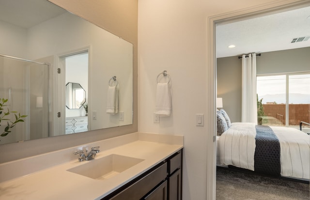 ensuite bathroom featuring vanity, an enclosed shower, ensuite bath, and visible vents