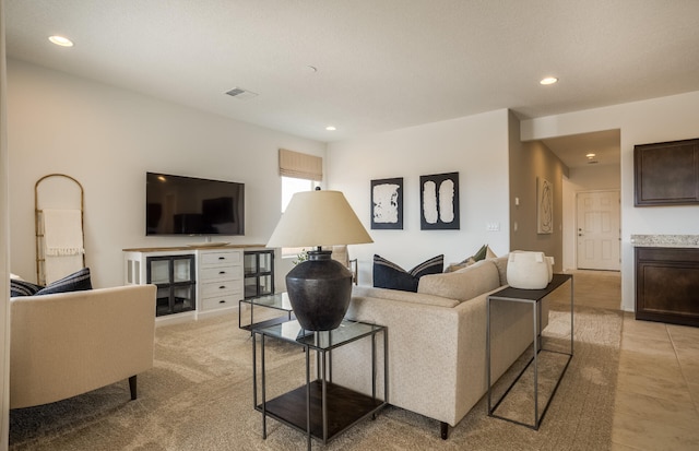 living area with visible vents and recessed lighting