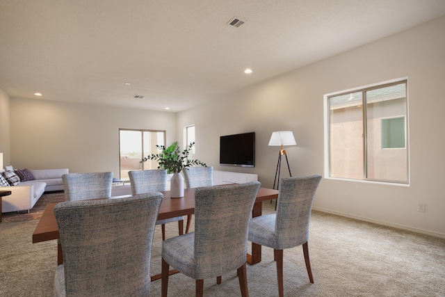 dining area featuring carpet floors, recessed lighting, plenty of natural light, and baseboards