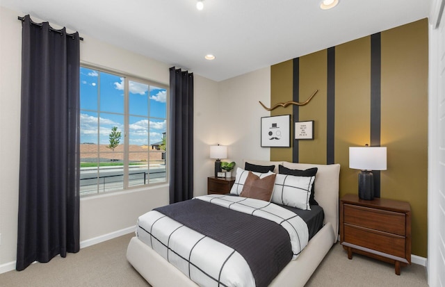 bedroom with recessed lighting, baseboards, and light colored carpet