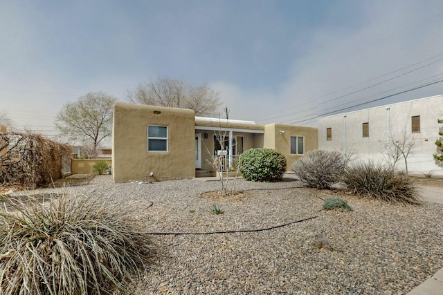 southwest-style home featuring stucco siding