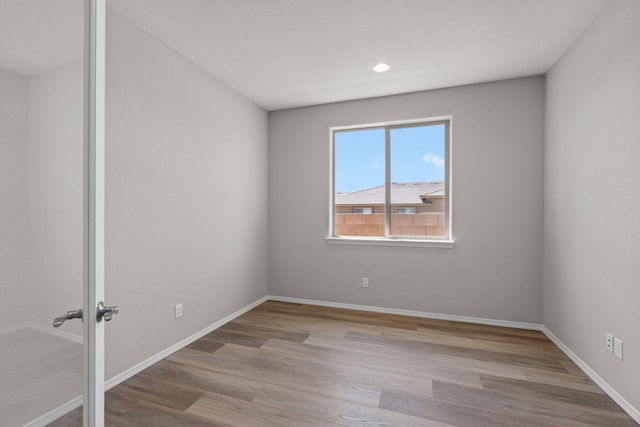 8401 Twain Way NW, Albuquerque, NM 87114 - unfurnished room featuring wood finished floors, baseboards, and recessed lighting