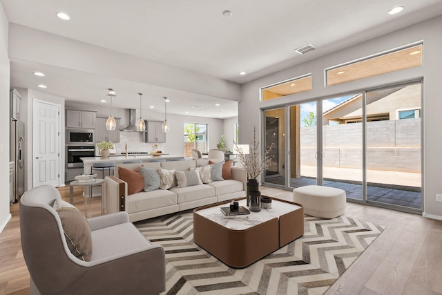 8401 Twain Way NW, Albuquerque, NM 87114 - living room featuring light wood finished floors and recessed lighting