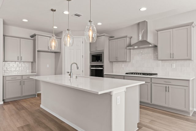 8401 Twain Way NW, Albuquerque, NM 87114 - kitchen with wall chimney exhaust hood, black oven, gray cabinets, gas stovetop, and recessed lighting