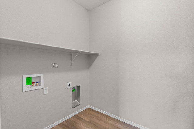 8401 Twain Way NW, Albuquerque, NM 87114 - laundry area with washer hookup, baseboards, wood finished floors, electric dryer hookup, and gas dryer hookup