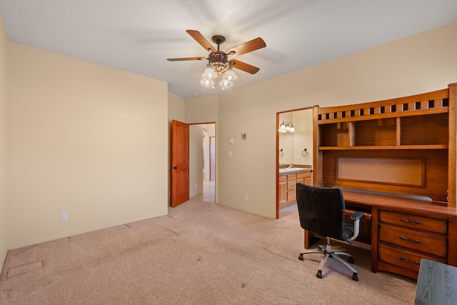 office area with ceiling fan and light carpet